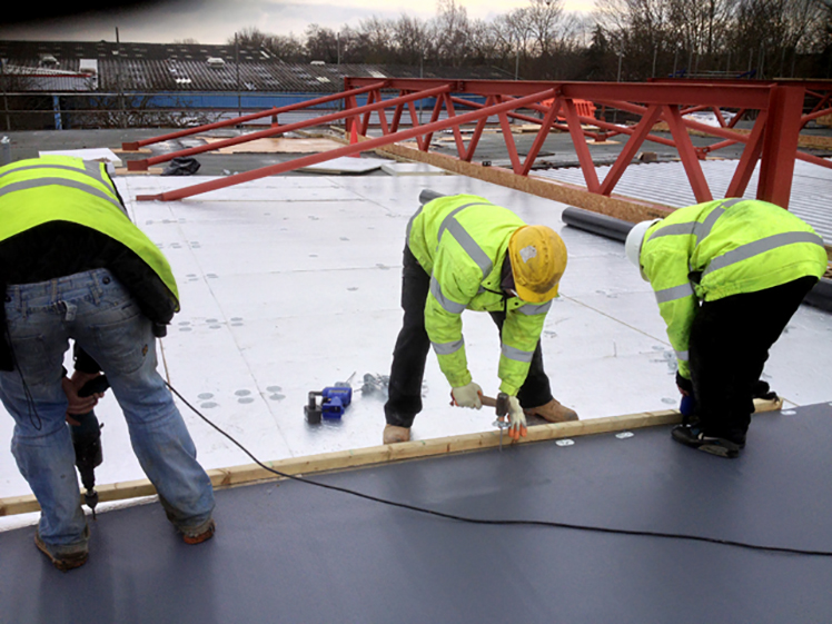 Workers On Roof