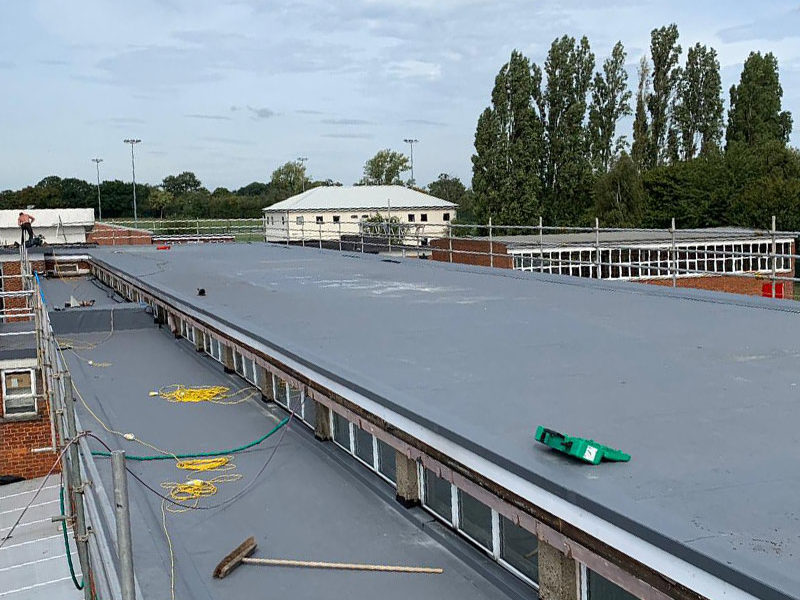 commercial flat roofing project near finishing