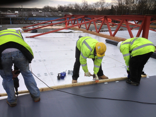 work team on flat roof